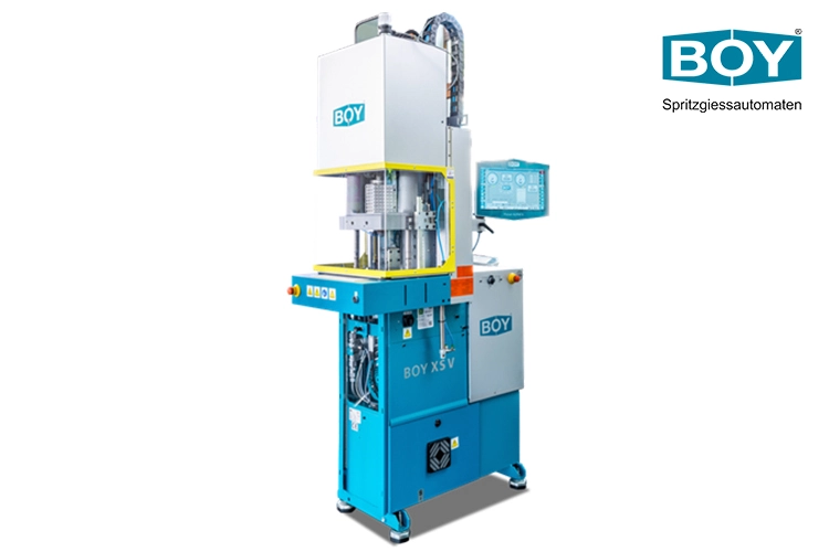 BOY XS V the smallest vertical injection moulding machine with 100kN clamping force, clearance between tie bars 160mm / 205mm diagonal and a max. shot weight of 7.3g (PS)